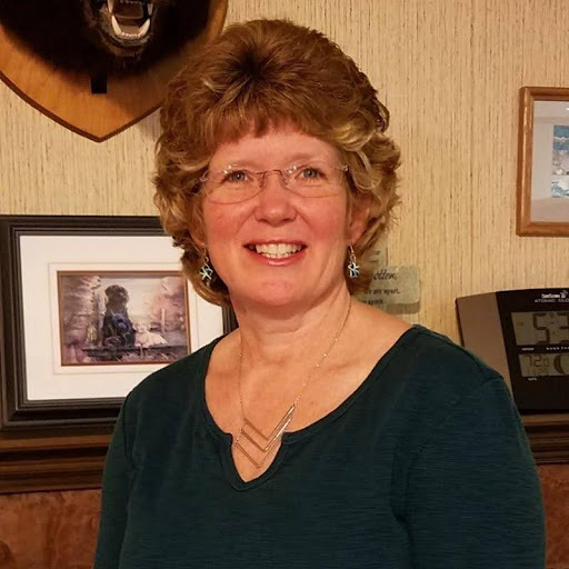 Candy smiling for the camera in an office at Ajax/CECO/Erie Press.